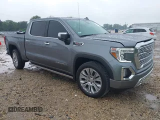 2021 GMC Sierra 1500 Denali with VIN 1GTU9FEL2MZ306258, listed as a IAAI auction lot 42427084 with 106,698 mi miles and . Bid and sale history available at DreamBid. Image 1.