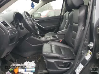 2016 Mazda CX-5 Grand Touring z VIN JM3KE2DY9G0687261, wystawiony jako Copart lot #52865415 z przebiegiem Nie podano mil oraz Szkoda całkowita • Salvage title. Historia ofert i sprzedaży dostępna na DreamBid. Obrazek 7.