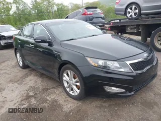 2012 Kia Optima EX z VIN 5XXGN4A79CG049431, wystawiony jako IAAI lot #42163569 z przebiegiem 162 352 mil mil oraz . Historia ofert i sprzedaży dostępna na DreamBid. Obrazek 1.