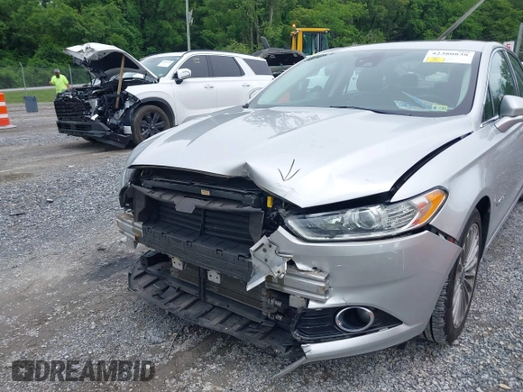 2013 Ford Fusion Titanium Hybrid with VIN 3FA6P0RU3DR281914, listed as a IAAI auction lot 42380838 with 166,956 mi miles and . Bid and sale history available at DreamBid. Image 6.