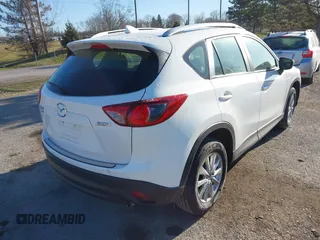 2016 Mazda CX-5 Sport with VIN JM3KE4BY8G0605504, listed as a IAAI auction lot 41866173 with 91,797 mi miles. Bid and sale history available at carsss.com. Image 4.