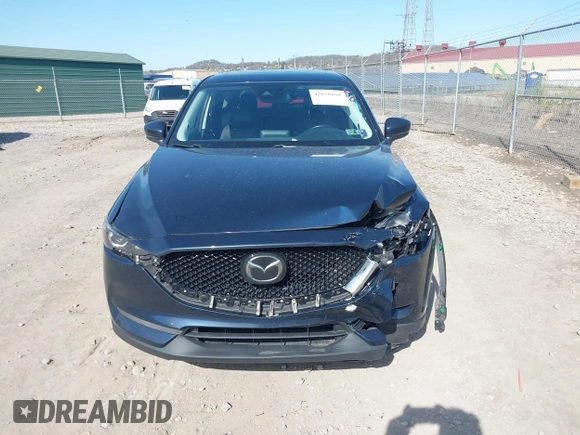 2019 Mazda CX-5 Touring with VIN JM3KFBCM8K0518806, listed as a IAAI auction lot 42038168 with 61,449 mi miles and . Bid and sale history available at DreamBid. Image 12.