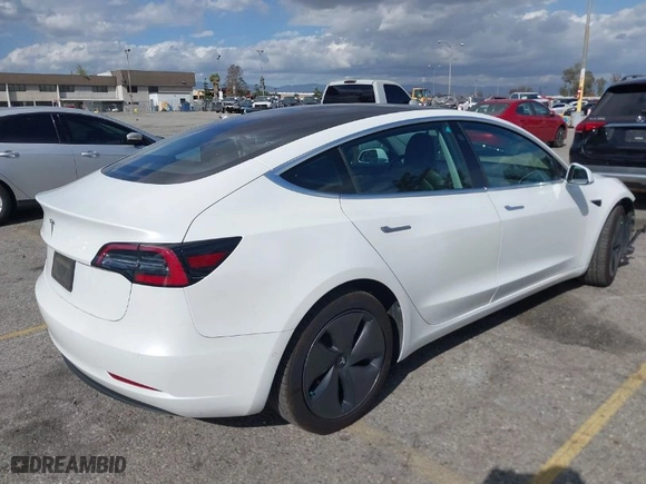 2018 Tesla Model 3 Long Range Battery with VIN 5YJ3E1EA8JF162130, listed as a IAAI auction lot 41933015 with 50,081 mi miles. Bid and sale history available at carsss.com. Image 4.