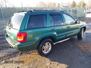1999 Jeep Grand Cherokee Limited with VIN 1J4GW68S1XC555399, listed as a IAAI auction lot 41764099 with 1 mi miles. Bid and sale history available at carsss.com. Image 4.