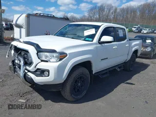 2020 Toyota Tacoma SR5 with VIN 3TMCZ5AN5LM339977, listed as a IAAI auction lot 41886937 with 94,986 mi miles and . Bid and sale history available at DreamBid. Image 2.