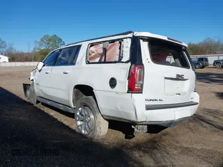 2019 GMC Yukon XL SLT with VIN 1GKS1GKC1KR335082, listed as a IAAI auction lot 41652504 with 135,824 mi miles. Bid and sale history available at carsss.com. Image 3.