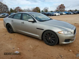 2014 Jaguar XJ with VIN SAJWA1CZ5E8V71971, listed as a Copart auction lot 82116114 with 127,164 mi miles and Salvage Title. Bid and sale history available at DreamBid. Image 4.