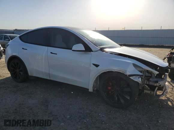2020 Tesla Model Y Long Range with VIN 5YJYGDEFXLF034617, listed as a Copart auction lot 53235235 with 113,480 mi miles and Salvage Title. Bid and sale history available at DreamBid. Image 4.