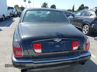 2001 Bentley Arnage with VIN SCBLC31E11CX06297, listed as a IAAI auction lot 41980275 with 63,510 mi miles and . Bid and sale history available at DreamBid. Image 16.