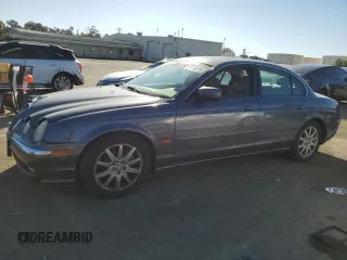 2000 Jaguar S-Type V8 with VIN SAJDA01DXYGL69453, listed as a Copart auction lot 43016615 with 132,230 mi miles and Salvage Title. Bid and sale history available at DreamBid. Image 1.