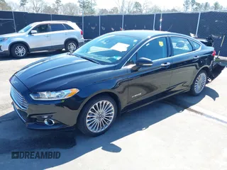 2013 Ford Fusion Titanium Hybrid with VIN 3FA6P0RU2DR288773, listed as a IAAI auction lot 41803708 with 85,868 mi miles and . Bid and sale history available at DreamBid. Image 2.
