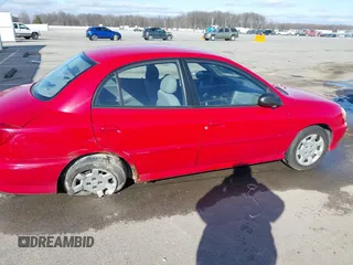 2002 Kia Rio with VIN KNADC123526160314, listed as a IAAI auction lot 41527989 with 124,252 mi miles. Bid and sale history available at carsss.com. Image 6.