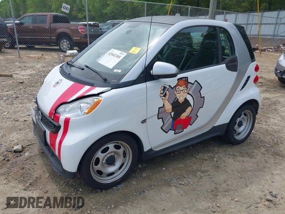 2014 Smart fortwo Pure with VIN WMEEJ3BA2EK733819, listed as a IAAI auction lot 42041305 with 69,018 mi miles and . Bid and sale history available at DreamBid. Image 2.