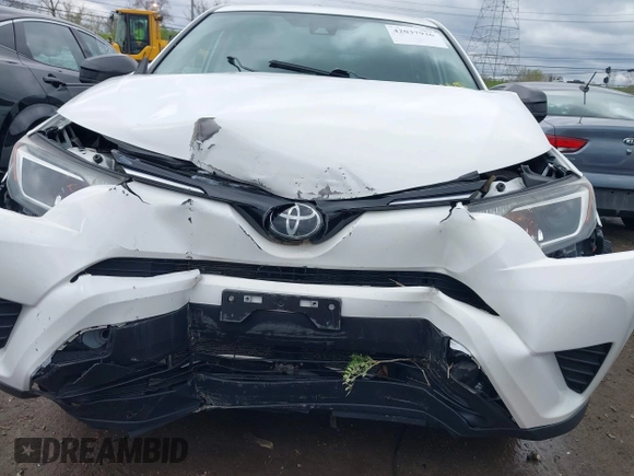 2018 Toyota RAV4 LE with VIN 2T3BFREVXJW793174, listed as a IAAI auction lot 42037936 with 82,304 mi miles. Bid and sale history available at carsss.com. Image 6.