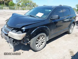 2014 Dodge Journey SXT with VIN 3C4PDCBG5ET250732, listed as a IAAI auction lot 41900940 with 144,301 mi miles. Bid and sale history available at carsss.com. Image 2.