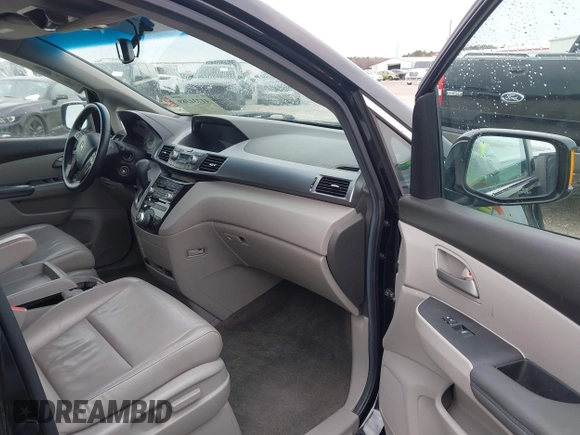 2012 Honda Odyssey Touring with VIN 5FNRL5H96CB058828, listed as a IAAI auction lot 41731389 with 152,295 mi miles and . Bid and sale history available at DreamBid. Image 5.