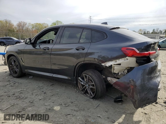 2019 BMW X4 M40i with VIN 5UXUJ5C5XKLJ64004, listed as a Copart auction lot 52106895 with 74,599 mi miles and Salvage title. Bid and sale history available at DreamBid. Image 2.