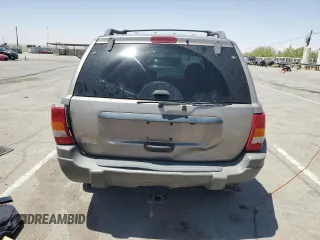 1999 Jeep Grand Cherokee Laredo with VIN 1J4GW58S1XC775877, listed as a Copart auction lot 55639795 with 197,611 mi miles and Salvage title. Bid and sale history available at DreamBid. Image 6.