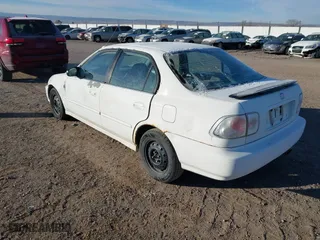 1998 Honda Civic LX with VIN 2HGEJ6675WH553663, listed as a IAAI auction lot 41062394 with 117,514 mi miles. Bid and sale history available at carsss.com. Image 3.