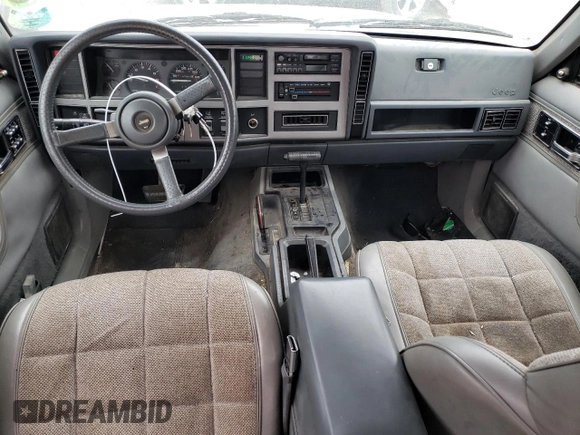 1991 Jeep Cherokee with VIN 1J4FJ58S1ML520376, listed as a Copart auction lot 75452364 with 147,982 mi miles and Salvage title. Bid and sale history available at DreamBid. Image 8.
