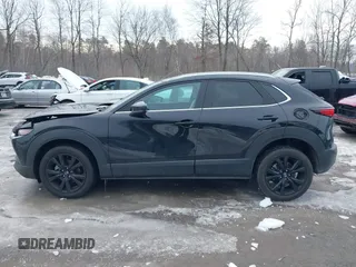2021 Mazda CX-30 Premium with VIN 3MVDMBDY1MM269353, listed as a IAAI auction lot 41644391 with 29,409 mi miles and . Bid and sale history available at carsss.com. Image 14.