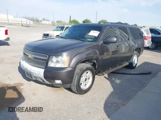 2011 Chevrolet Suburban LT with VIN 1GNSKJE34BR242629, listed as a IAAI auction lot 42043276 with 197,722 mi miles. Bid and sale history available at carsss.com. Image 2.