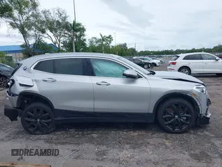2022 BMW X2 sDrive28i z VIN WBXYH9C09N5T71828, wystawiony jako IAAI lot #40536245 z przebiegiem 36 012 mil mil oraz . Historia ofert i sprzedaży dostępna na DreamBid. Obrazek 14.