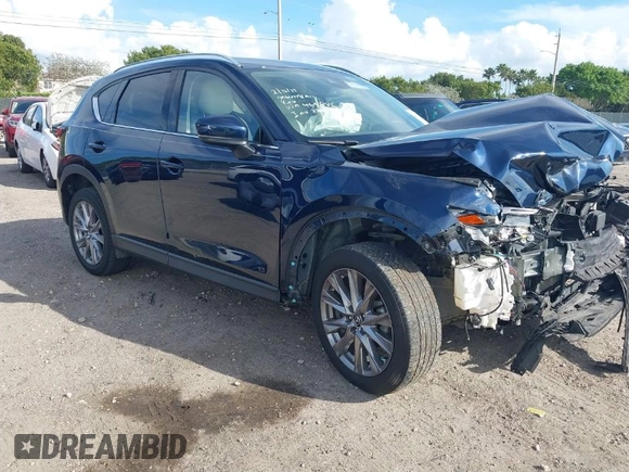2021 Mazda CX-5 Grand Touring with VIN JM3KFADM0M0469886, listed as a IAAI auction lot 41617270 with 33,571 mi miles. Bid and sale history available at carsss.com. Image 1.