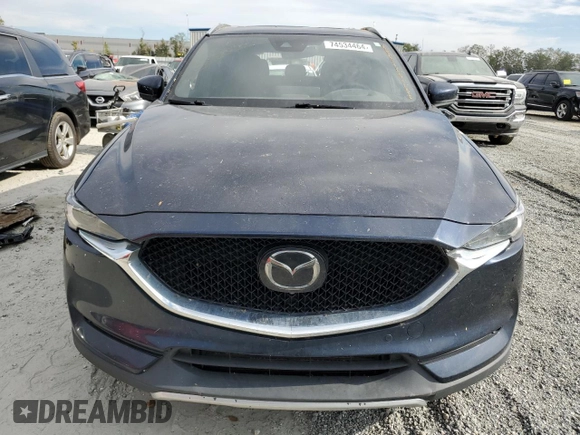 2021 Mazda CX-5 Signature with VIN JM3KFBEY3M0439658, listed as a Copart auction lot 74534464 with 50,816 mi miles and Salvage Title. Bid and sale history available at carsss.com. Image 5.