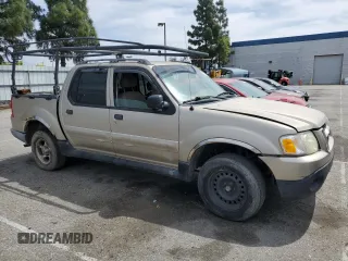 2005 Ford Explorer Sport Trac XLS with VIN 1FMZU67K05UA59602, listed as a Copart auction lot 56756175 with 136,440 mi miles and Salvage title. Bid and sale history available at DreamBid. Image 4.