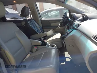 2012 Honda Odyssey Touring with VIN 5FNRL5H92CB108690, listed as a IAAI auction lot 41826580 with 150,327 mi miles and . Bid and sale history available at DreamBid. Image 5.