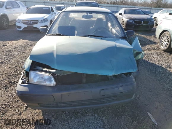1996 Toyota Tercel DX z VIN JT2AC52L6T0170537, wystawiony jako Copart lot #42576525 z przebiegiem 66 926 mil mil oraz Szkoda całkowita • Salvage title. Historia ofert i sprzedaży dostępna na DreamBid. Obrazek 5.