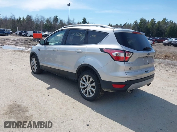 2017 Ford Escape Titanium with VIN 1FMCU9JD3HUE03686, listed as a IAAI auction lot 42016950 with 82,299 mi miles. Bid and sale history available at carsss.com. Image 3.