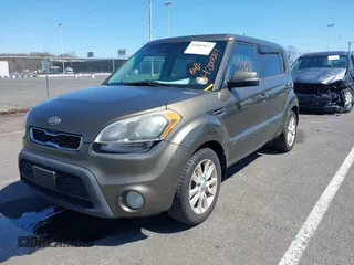 2012 Kia Soul + with VIN KNDJT2A68C7458729, listed as a IAAI auction lot 42002817 with 249,600 mi miles. Bid and sale history available at carsss.com. Image 2.