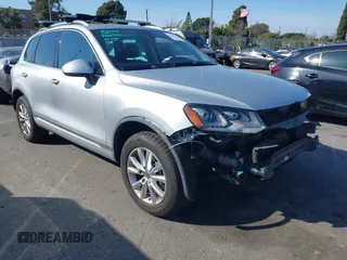 2014 Volkswagen Touareg Sport with VIN WVGEF9BP8ED006479, listed as a IAAI auction lot 41557661 with 114,812 mi miles and . Bid and sale history available at DreamBid. Image 1.