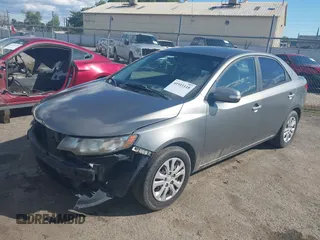 2010 Kia Forte EX with VIN KNAFU4A28A5229372, listed as a IAAI auction lot 41911118 with 166,084 mi miles. Bid and sale history available at carsss.com. Image 2.