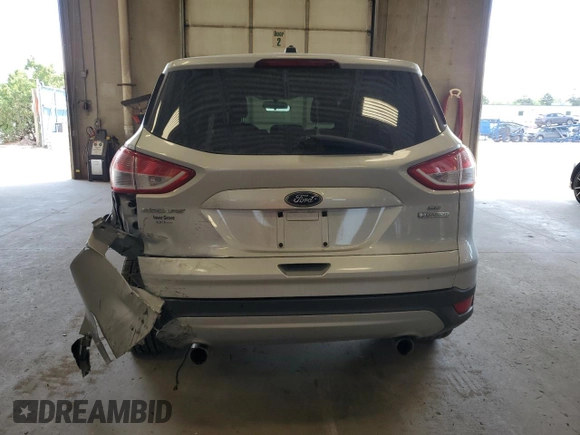 2013 Ford Escape SE with VIN 1FMCU0GXXDUB10035, listed as a Copart auction lot 56817785 with 130,497 mi miles and Salvage title. Bid and sale history available at DreamBid. Image 6.
