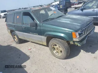 1996 Jeep Grand Cherokee Laredo with VIN 1J4FX58S9TC300710, listed as a IAAI auction lot 42073391 with 1 mi miles. Bid and sale history available at carsss.com. Image 1.