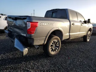 2019 Nissan Titan XD SV with VIN 1N6BA1F4XKN532266, listed as a Copart auction lot 77098244 with 105,965 mi miles and Salvage Title. Bid and sale history available at carsss.com. Image 3.