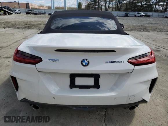2021 BMW Z4 sDrive30i with VIN WBAHF3C09MWX24087, listed as a Copart auction lot 52036575 with 0 mi miles and Salvage Title. Bid and sale history available at carsss.com. Image 6.