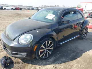 2012 Volkswagen Beetle 2.0T Turbo with VIN 3VWV67ATXCM648515, listed as a IAAI auction lot 41666994 with 142,085 mi miles. Bid and sale history available at carsss.com. Image 2.