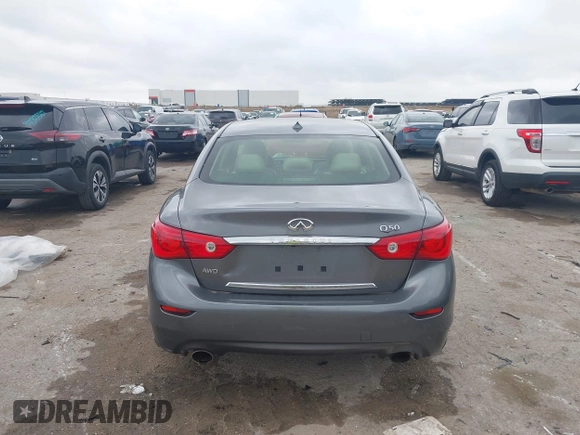 2015 Infiniti Q50 Premium z VIN JN1BV7AR9FM413801, wystawiony jako IAAI lot #42134770 z przebiegiem 111 367 mil mil oraz . Historia ofert i sprzedaży dostępna na DreamBid. Obrazek 16.