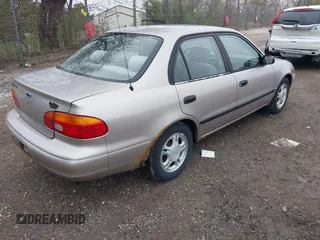 1999 Chevrolet Prizm z VIN 1Y1SK5488XZ446933, wystawiony jako IAAI lot #42167872 z przebiegiem 218 987 mil mil oraz . Historia ofert i sprzedaży dostępna na DreamBid. Obrazek 4.