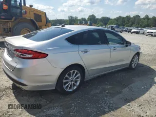 2017 Ford Fusion SE z VIN 3FA6P0H74HR164747, wystawiony jako Copart lot #56139855 z przebiegiem 105 769 mil mil oraz Szkoda całkowita • Salvage title. Historia ofert i sprzedaży dostępna na DreamBid. Obrazek 3.