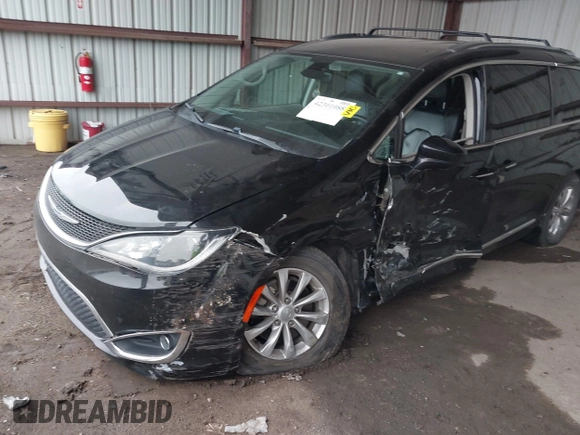 2018 Chrysler Pacifica Touring L z VIN 2C4RC1BG8JR211405, wystawiony jako IAAI lot #42301088 z przebiegiem 92 876 mil mil oraz . Historia ofert i sprzedaży dostępna na DreamBid. Obrazek 17.