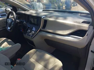 2015 Toyota Sienna L with VIN 5TDZK3DCXFS640245, listed as a IAAI auction lot 42310815 with 76,260 mi miles and . Bid and sale history available at DreamBid. Image 5.
