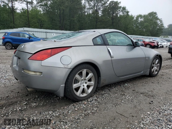 2003 Nissan 350Z Performance z VIN JN1AZ34D33T106988, wystawiony jako Copart lot #57933985 z przebiegiem 203 959 mil mil oraz Szkoda całkowita • Salvage title. Historia ofert i sprzedaży dostępna na DreamBid. Obrazek 3.