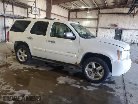 2007 Chevrolet Tahoe LTZ with VIN 1GNFK13007J313566, listed as a Copart auction lot 52498975 with 234,744 mi miles and Salvage title. Bid and sale history available at DreamBid. Image 4.