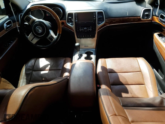 2012 Jeep Grand Cherokee Overland with VIN 1C4RJECTXCC227769, listed as a Copart auction lot 68760174 with 144,537 mi miles and Salvage Title. Bid and sale history available at carsss.com. Image 8.