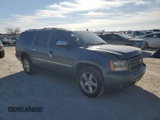 2010 Chevrolet Suburban LTZ with VIN 1GNUKKE37AR165641, listed as a Copart auction lot 88939935 with 203,190 mi miles and Salvage title. Bid and sale history available at DreamBid. Image 4.